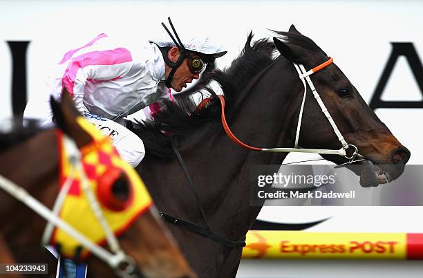 Jockey Chris Munce riding Rainbow Styling holds on to win Race 8 the Durban Naturalism Stakes during Underwood Stakes Day at Caulfield Racecourse on...