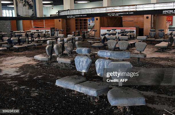 Bird droppings cover seats in a waiting room inside the old Nicosia airport terminal building, now located within the UN-controlled buffer zone that...