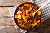 delicious stew estofado with beef and vegetables close-up. Horizontal top view