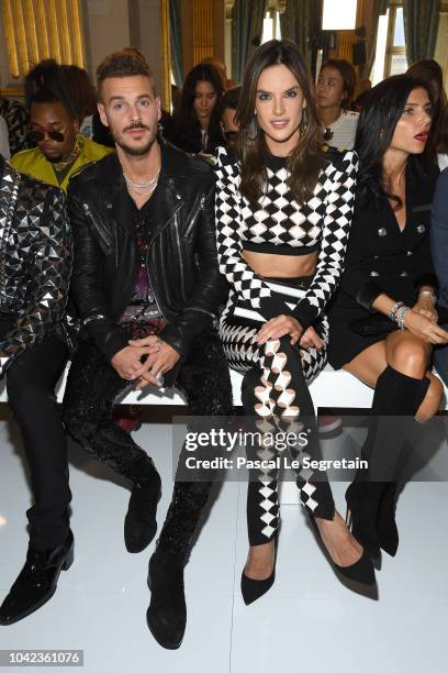 Matt Pokora and Alessandra Ambrosio attend the Balmain show as part of the Paris Fashion Week Womenswear Spring/Summer 2019 on September 28, 2018 in...