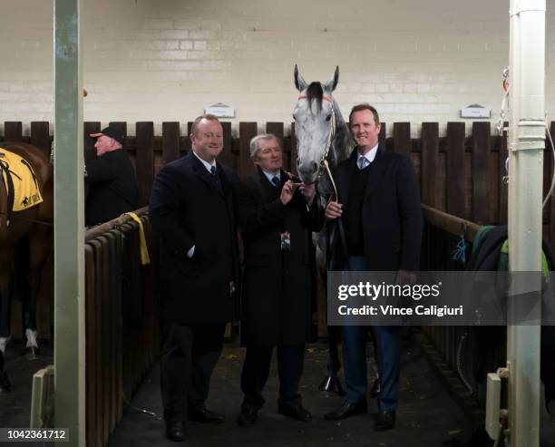 Wayne Hawkes, John Hawkes and Michael Hawkes pose with Chautauqua before his barrier trial during Melbourne Racing at Moonee Valley Racecourse on...