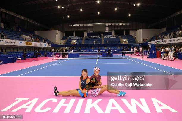 Doubles champion Makoto Ninomiya and Miyu Kato of Japan pose for photographs after the Doubles final against Barbora Strycova and Andrea Sestini...