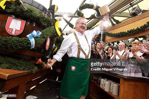 Munich's mayor Christian Ude opens the Oktoberfest after opening the first beer barrel to start the Oktoberfest beer festival at the Schottenhamel...