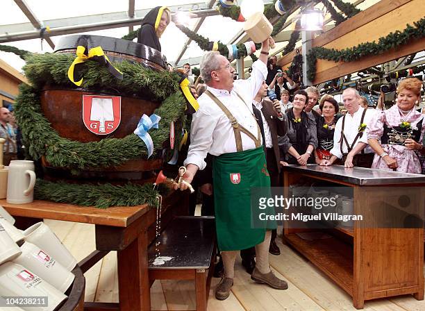 Munich's mayor Christian Ude opens the Oktoberfest after opening the first beer barrel to start the Oktoberfest beer festival at the Schottenhamel...
