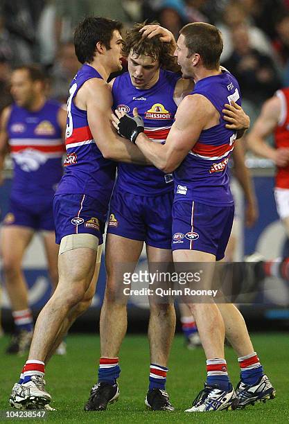 Liam Picken of the Bulldogs is congratulated by team-mates after kicking a goal during the Seecond AFL Preliminary Final match between the St Kilda...