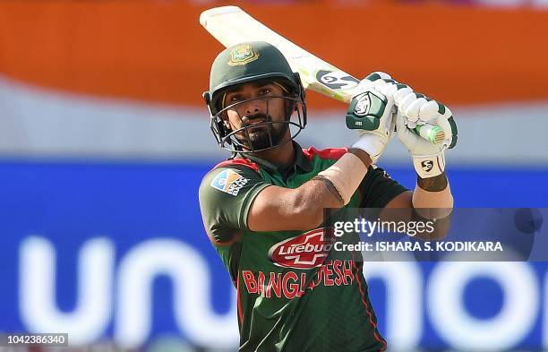 Bangladesh batsman Liton Das plays a shot during the start of the final one day international Asia Cup cricket match between Bangladesh and India at...