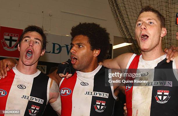 Lenny Hayes, James Gwilt and Zac Dawson of the Saints sing the song in the rooms after winning the Second AFL Preliminary Final match between the St...