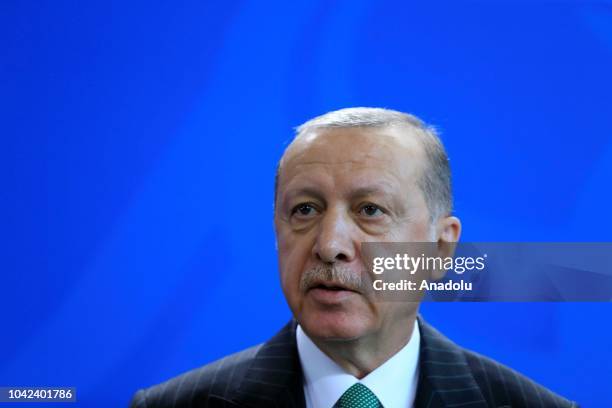 Turkish President Recep Tayyip Erdogan and German Chancellor Angela Merkel hold a joint press conference following their meeting in Berlin, Germany...