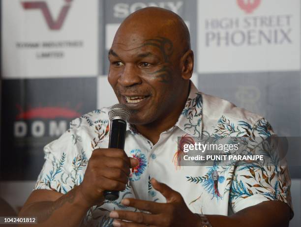 Former US boxer Mike Tyson speaks during a news conference to announce India's first global mixed martial arts Kumite 1 league in Mumbai on September...