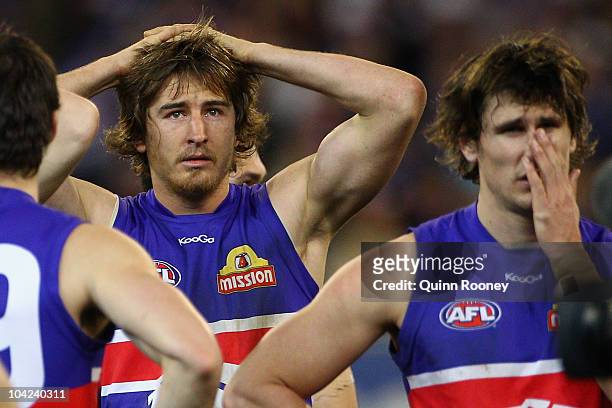 Dylan Addison and Ryan Griffen of the Bulldogs look dejected after losing the Seecond AFL Preliminary Final match between the St Kilda Saints and the...