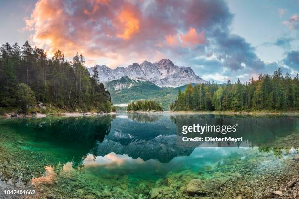 mountain peak zugspitze summer day at lake eibsee near garmisch partenkirchen. bavaria, germany - panoramic stock pictures, royalty-free photos & images