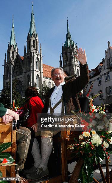 The mayor of Munich Christian Ude waves as he arrives for the opening ceremony of the Oktoberfest at Theresienwiese on September 18, 2010 in Munich,...