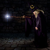 A wizard pointing his glowing wand