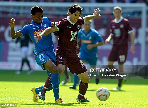 Srdjan Lakic of Kaiserslautern battles for the ball with Luiz Gustavo of Hoffenheim during the Bundesliga match between 1.FC Kaiserslautern and TSG...