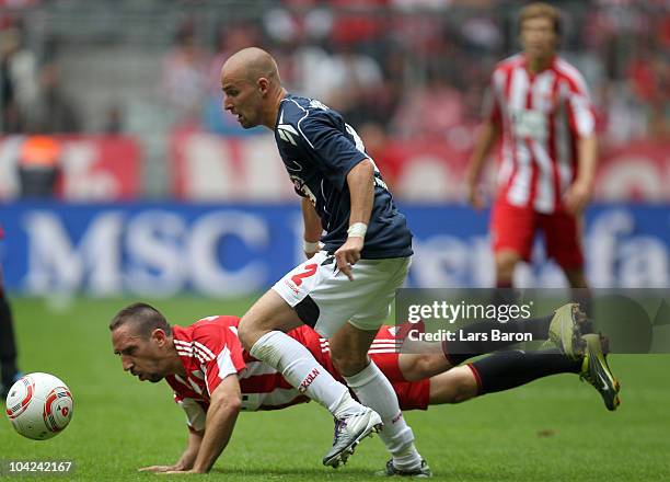 Franck Ribery of Muenchen is challenged by Miso Brecko of Koeln during the Bundesliga match between FC Bayern Muenchen and 1. FC Koeln at Allianz...