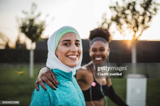 friends working out together - two people talking outside stock pictures, royalty-free photos & images