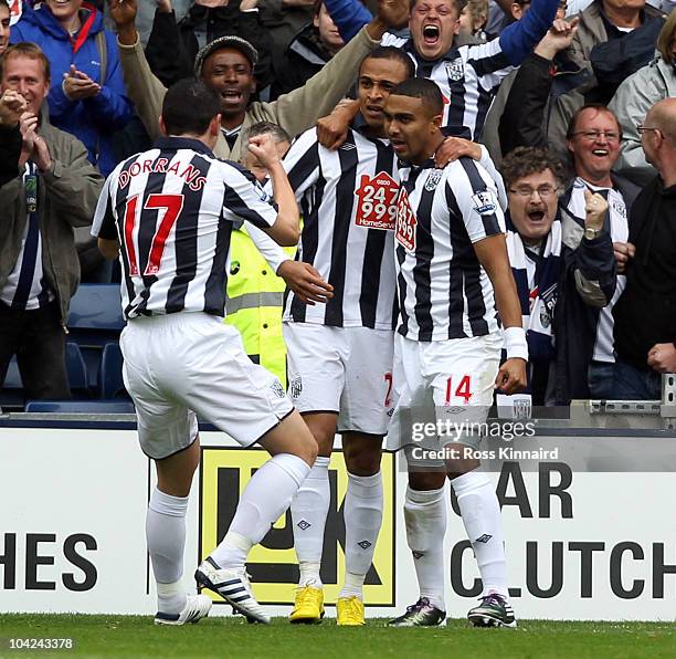 Peter Odemwingie of West Brom is congratulated after he scores during the Barclays Premier League match between West Bromwich Albion and Birmingham...