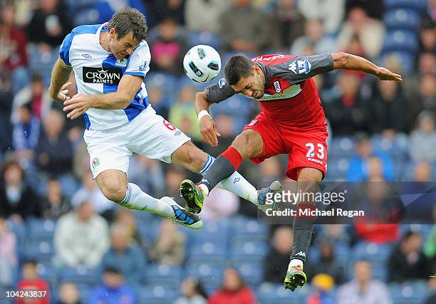 Clint Dempsey of Fulham battles Ryan Nelson of Blackburn during the Barclays Premier League match between Blackburn Rovers and Fulham at Ewood park...