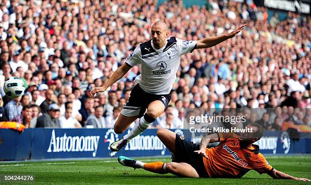 Alan Hutton of Spurs is brought down by Steven Fletcher of Wolves during the Barclays Premier League match between Tottenham Hotspur and...