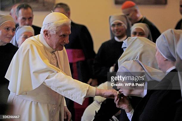 Pope Benedict XVI meets elderly people a visit to St Peter's Residence for Older People during the third day of his State Visit on September 18, 2010...
