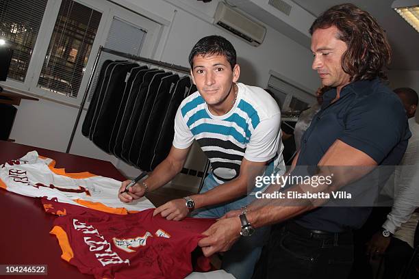 Belstaff's Manuele Malenotti and AS Roma's football player Gulliermo Enio Burdisso attend the Belstaff Official Meeting with AS Roma football team at...