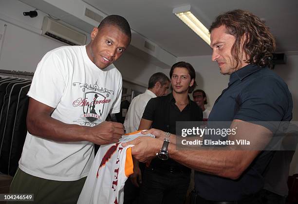 Belstaff's Manuele Malenotti and AS Roma's football player Julio Cesar Baptista attend the Belstaff Official Meeting with AS Roma football team at...