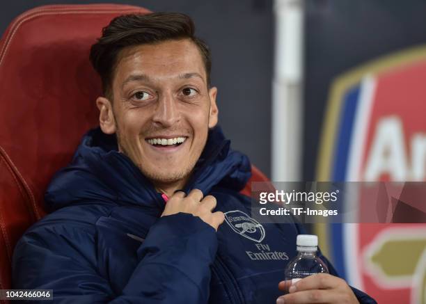 Mesut Ozil of Arsenal laughs during the UEFA Europa League Group E match between Arsenal and Vorskla Poltava at Emirates Stadium on September 20,...