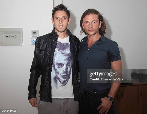 Belstaff's Manuele Malenotti and AS Roma's football player Leandro Greco attend the Belstaff Official Meeting with AS Roma football team at the AS...
