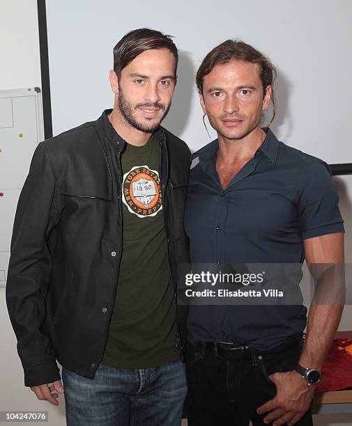 Belstaff's Manuele Malenotti and AS Roma's football player Marco Cassetti attend the Belstaff Official Meeting with AS Roma football team at the AS...