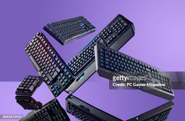 Group of mechanical PC keyboards, including an Asus ROG Claymore, Logitech Orion Spark G910, Razer Blackwidow Chroma V2 and a Cooler Master...