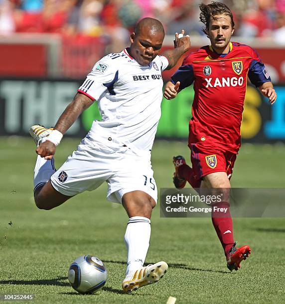 Collins John of the Chicago Fire takes a shot on goal as Ned Grabavoy of Real Salt Lake looks on during the first half of an MLS soccer game...