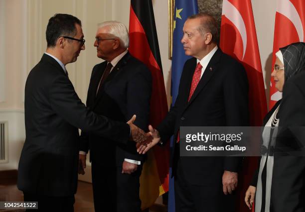 Leading German Greens Party member Cem Ozdemir , an outspoken critic of Erdogan, shakes hand with Turkish President Recep Tayyip Erdogan as Turkish...