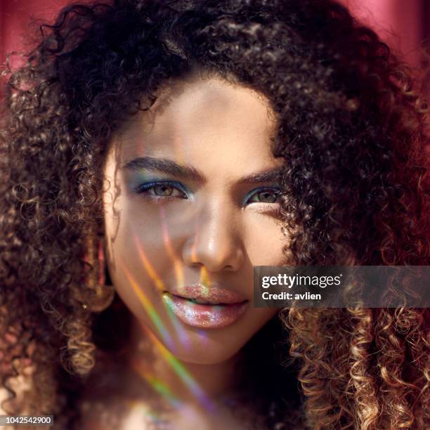 Portrait Of Beautiful Young Woman With Curly Hair