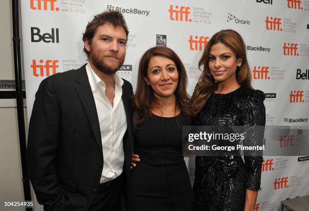 Actor Sam Worthington, writer/director/producer Massy Tadjedin and actress Eva Mendes pose in the green room at the "Last Night" Premiere during the...