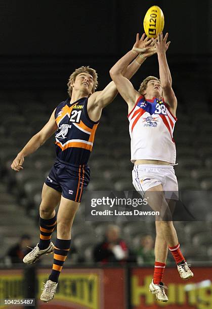 Matthew Watson of the Cannons and Clay Smith of the Power contest for a mark during the TAC Cup Grand Final match between the Calder Cannons and...