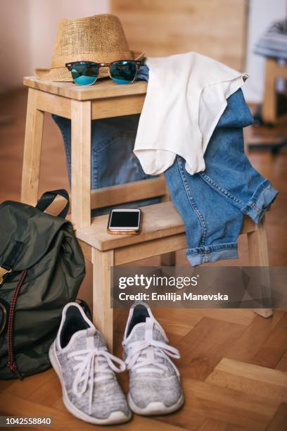 casual clothes. jeans. t-shirt, sunglasses, shoes and hat - escape the room event stock pictures, royalty-free photos & images