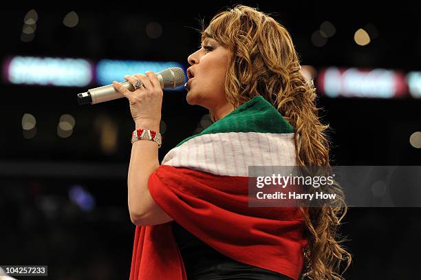 Jenny Rivera sings the Mexican national anthem before the Middleweight bout against Shane Mosley and Sergio Mora at Staples Center on September 18,...