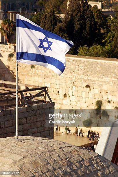 israeli flag over the western wall - jerusalem - western wall stock pictures, royalty-free photos & images