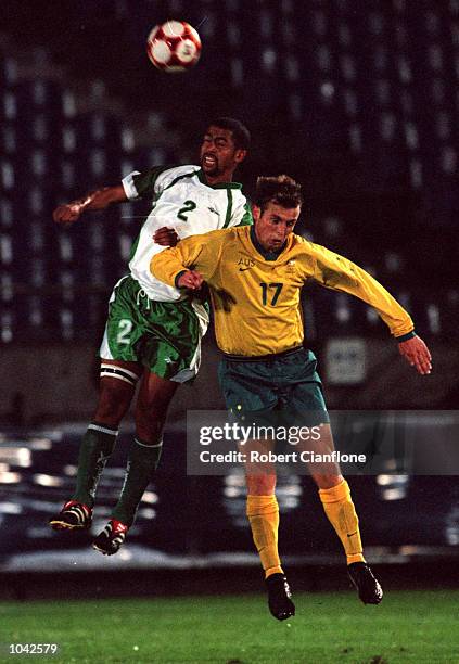 Bennedict McCarthy of South Africa challenges Michael Curcija of Australia during the friendly match between the Australian Olyroos and South Africa,...