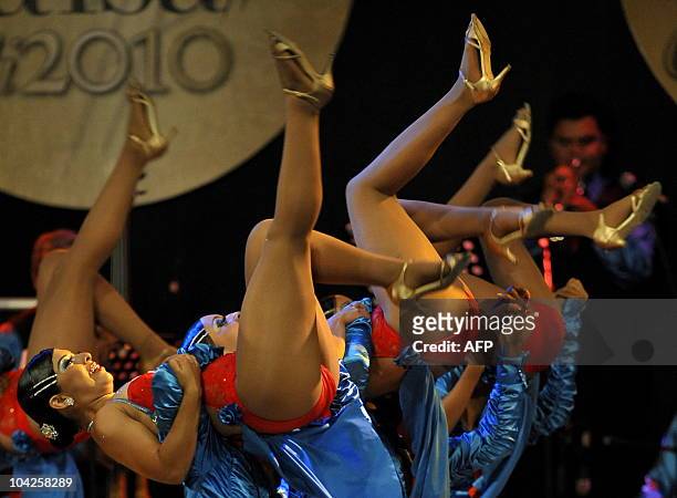 Members of Colombia's "Constelacion Salsera" Dance School perform during the assembly groups category of the 5th World Salsa Festival at the...