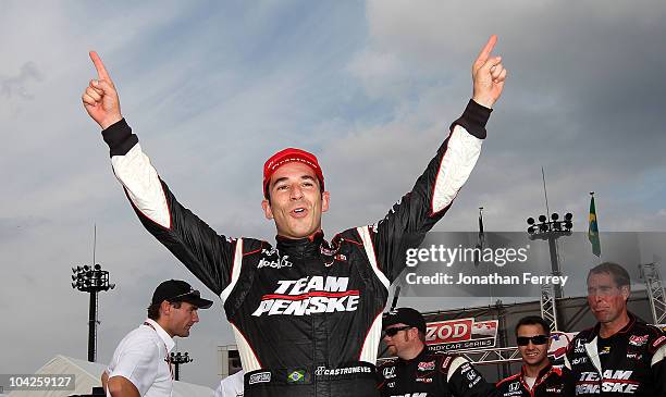 Helio Castroneves of Brazil, driver of the Team Penske Dallara Honda celebrates winning the IndyCar Series Indy Japan 300 on September 19, 2010 at...