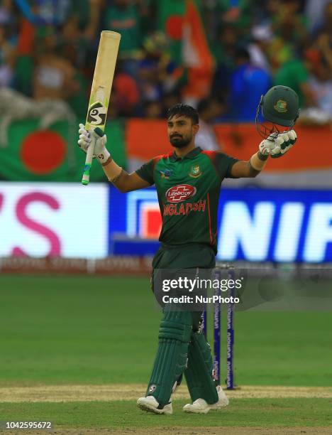 Bangladesh cricketer Liton Das celebrates after scoring 100 runs during the final cricket match of Asia Cup 2018 between India and Bangladesh at...