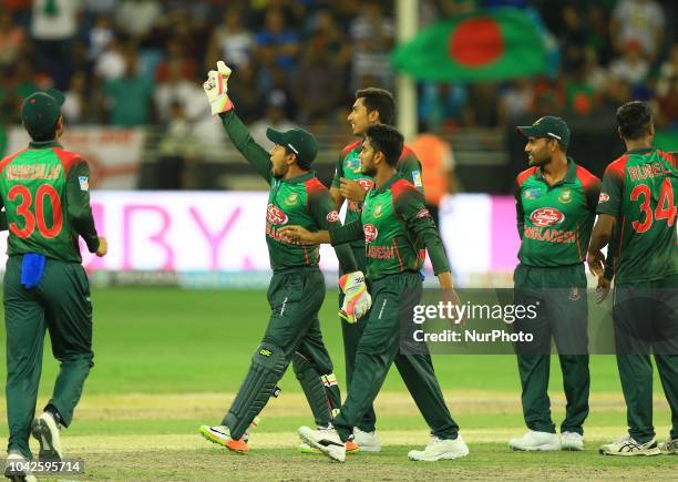 Bangladesh cricketers celebrate during the final cricket match of Asia Cup 2018 between India and Bangladesh at Dubai International cricket...