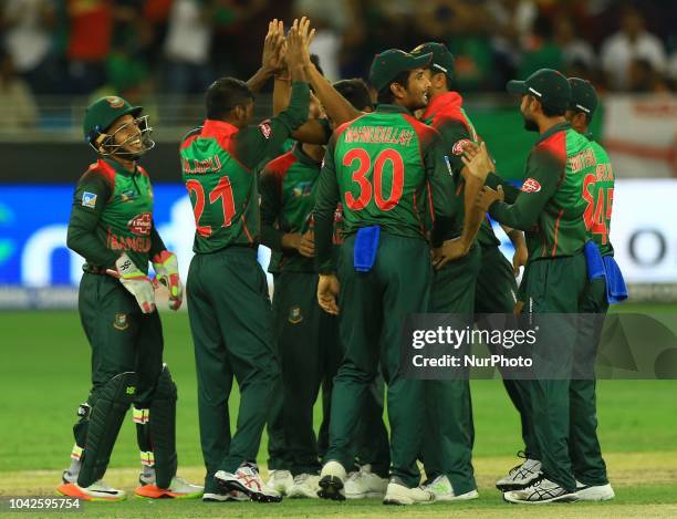Bangladesh cricketers celebrate during the final cricket match of Asia Cup 2018 between India and Bangladesh at Dubai International cricket...
