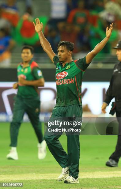 Bangladesh cricketer Rubel Hossain celebrates after taking a wicket during the final cricket match of Asia Cup 2018 between India and Bangladesh at...