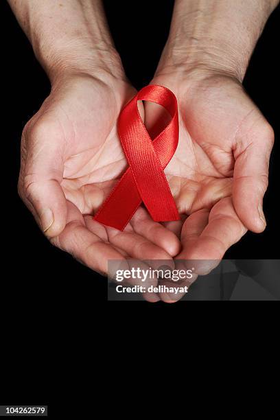 Red Ribbon Hands Photos and Premium High Res Pictures - Getty Images