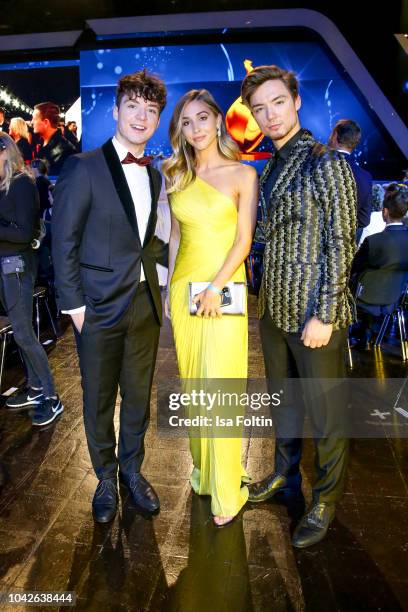 Model Ann-Kathrin Goetze with youtube stars Roman and Heiko Lochmann alias Die Lochis during the Goldene Henne on September 28, 2018 in Leipzig,...