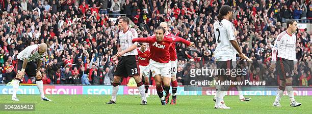 Dimitar Berbatov of Manchester United celebrates scoring their second goal during the Barclays Premier League match between Manchester United and...