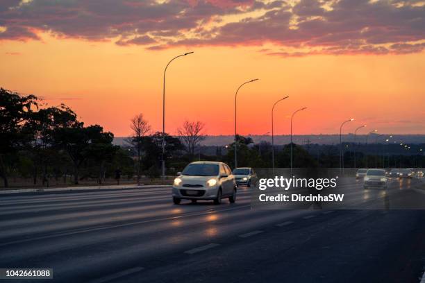 sunset in brasilia stree, brazil. - distrito-federal-brasilia stock-fotos und bilder