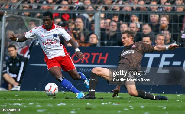 Matthias Lehmann of St. Pauli and Eljero Elia of Hamburg battle for the ball during the Bundesliga match between FC St. Pauli and Hamburger SV at...